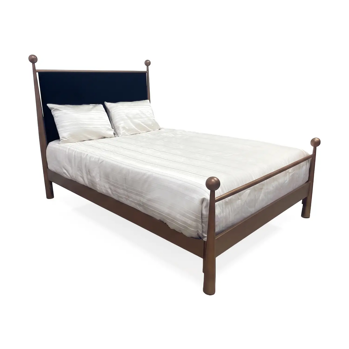 Olympus Iron Bed shown in Opaque Copper Finish with Black Velvet Performance Fabric. The Olympus bed is shown in angle view with silky luxurious cream bedding.